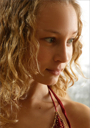 18 year old beauty Agnes takes great care in flaunting perky tits in the nude